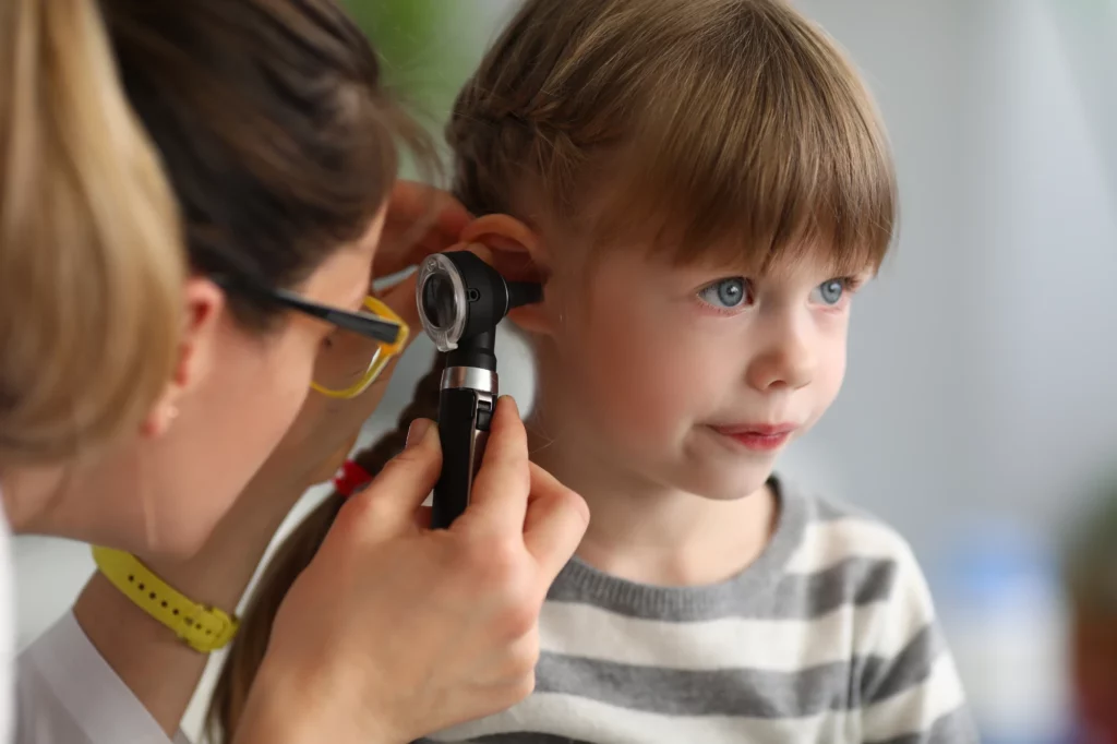 Fidelity Hearing Audiologist checking childs ear